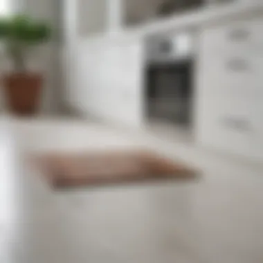 Close-up view of flooring samples next to white cabinetry