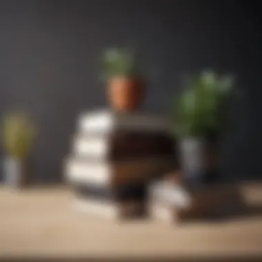 Minimalistic workspace featuring a stack of design books as decor