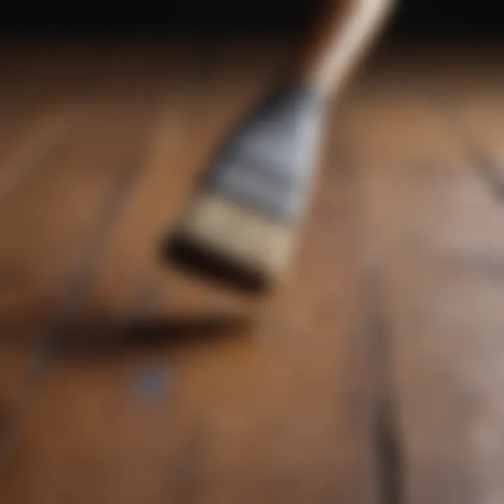 Close-up of a paintbrush on a wooden surface