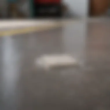 Applying soap to a garage floor