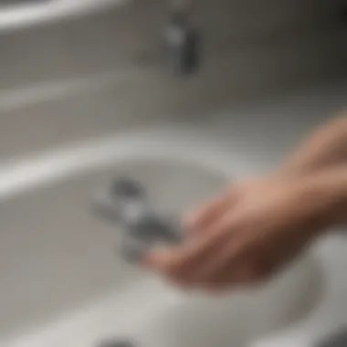 Demonstration of using a wrench on a sink disposal.