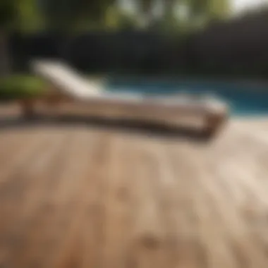 Modern wooden decking with poolside loungers